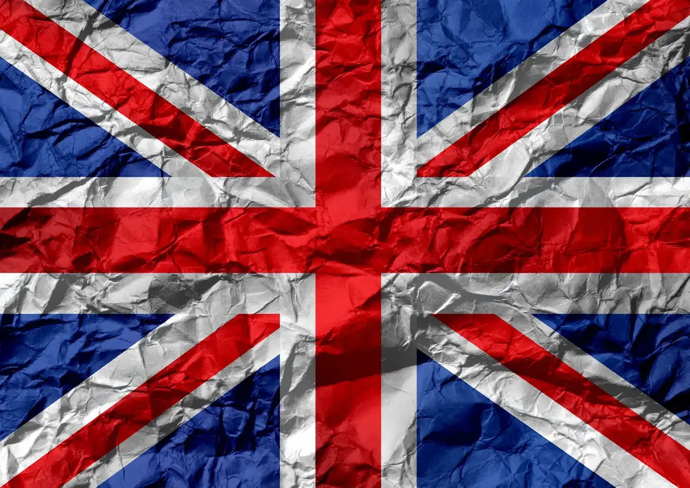 Grungy textured background designed as full frame flag of United Kingdom on crumpled paper