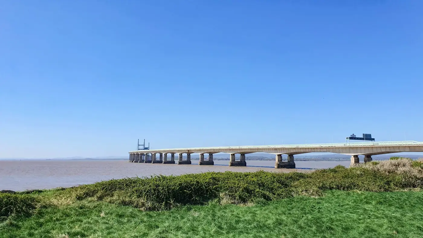 The iconic Severn Bridge spanning the River Severn on a clear sunny day in the United Kingdom.