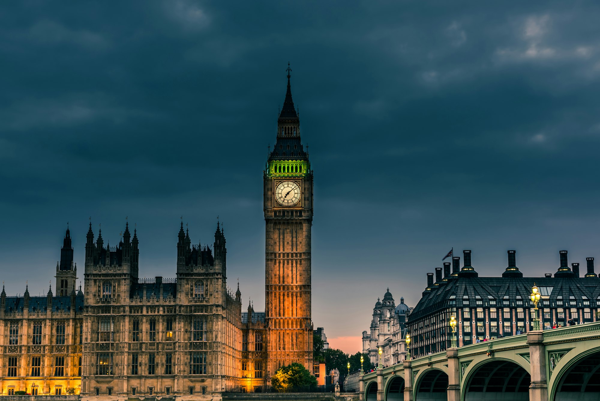 Westminster abbey and big ben in the London skyline at night, London, UK